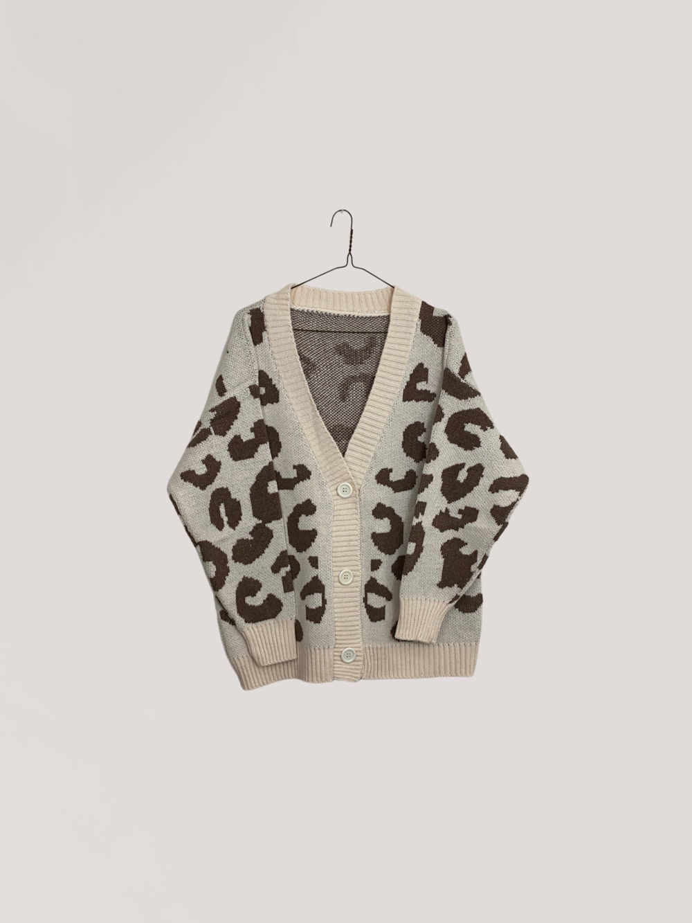 “Luxe Wild Knit Cardigan – Signature Animal Print Collection”