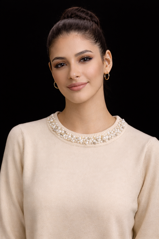 Elegant long-sleeve knit blouse featuring a luxurious pearl